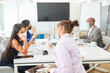 © Robert Kneschke - Business team with face mask in a meeting