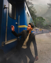 Man Boarding A Train With Steam And Motains On A Jungle Forest