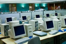 Wide Angle Shot Of A Business Environment With A Myriad Of Old Computers In The Room