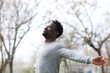 © PheelingsMedia - Satisfied black man breathing fresh air in the park