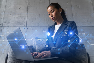 Businesswoman typing on laptop work on new project. Technology drawing hologram. Double exposure. Concept of success.