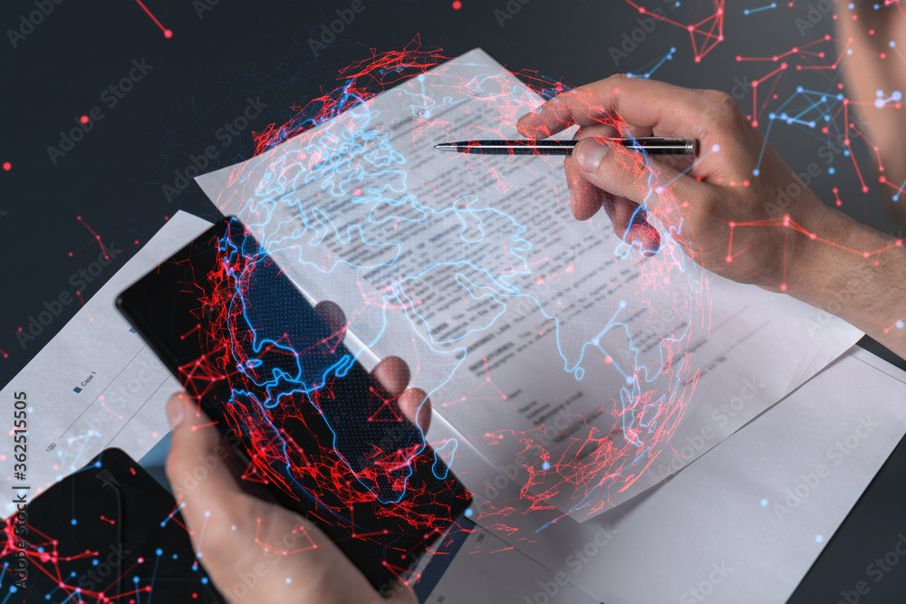 Double exposure of man signing contract with phone and world map ...