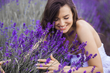 Close up portrait of beautiful young woman in lavender field.