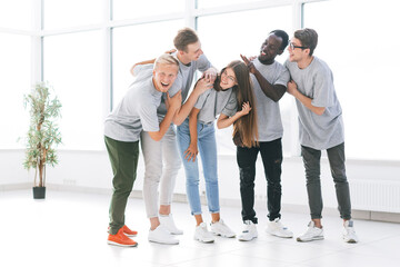 Wall Mural - team of young professionals standing in a bright office