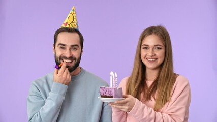 Sticker - Cheerful young lovely couple having fun on birthday party over purple background