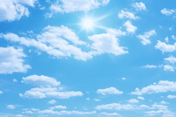 Wall Mural - blue sky with sun and clouds background