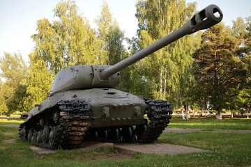 Old battle tank under the trees, participated in the 2nd world war.