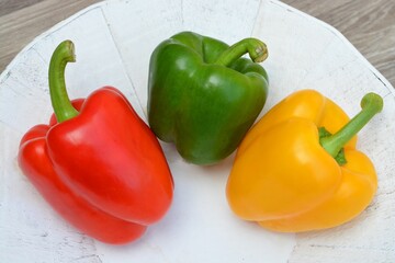 Sticker - Closeup shot of fresh peppers in a white plate