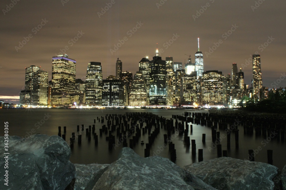 View Of City Lit Up At Night - obrazy, fototapety, plakaty 