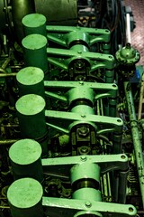 Canvas Print - Vertical shot of a green boat engine space