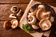 Paris Or Champignon And Shitake Mushroom On Wood Background