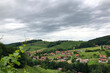 hills dramatic cloudy sky village