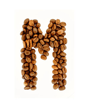 M, Alphabet from coffee beans on white background