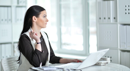 Portrait of businesswoman working in office