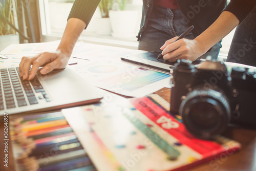 Fotomural Midsection Of Design Professional Using Laptop On Table