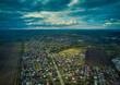 Aerial view from drone. Aerial view amazing sunset over of the suburbs with the city, far villages and fields