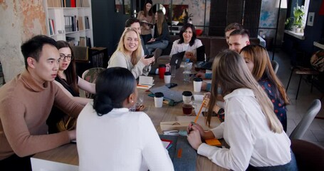 Wall Mural - High angle rear view, multiethnic happy business people listen to young African female coach at modern office meeting.