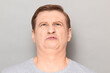 © Andrei Korzhyts - Portrait of funny man grimacing from disgust and squeamishness