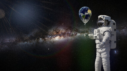 Wall Mural - astronaut with planet earth balloon