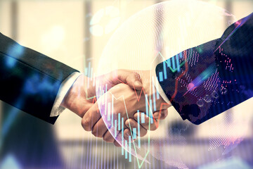 Double exposure of forex graph hologram and handshake of two men. Stock market concept.