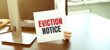 Businesswoman Holding A Card With Text Eviction Notice