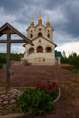 Church of St. Sergius of Radonezh in the village of Velednikovo near Moscow. In the foreground is a large wooden cross