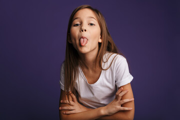 photo of amusing beautiful girl showing her tongue on camera