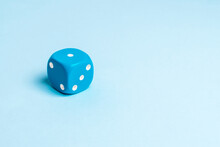 Close-up Of Dice On Blue Background