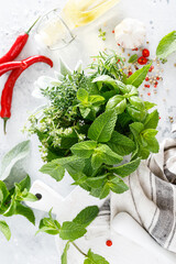 Canvas Print - Bunch of aromatic herbs in mortar on kitchen table