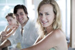 © ImageHit - Man and women sitting at the bar counter