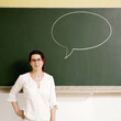 © ImageHit - Woman with a speech bubble on the blackboard