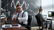 © Svitlana - Earn right. Stylish businessman, trader looking at his wristwatch while working using wireless earphones. His colleague and blackboard full of charts and data analyses in the background.
