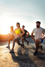 Portrait Of Smiling Fit Happy People Doing Power Fitness Exercise