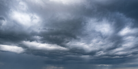 panorama of black sky background with storm clouds. thunder front