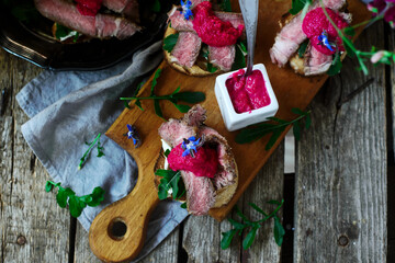 Wall Mural - Crostini with ribeye and horseradish. style rustic