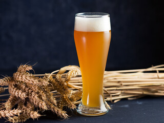 Wall Mural - Close up of a glass of unfiltered cold wheat beer