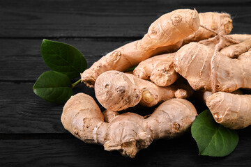 Fresh ginger root on stone background. Vitamins. Top view. Free space for your text.