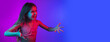 © master1305 - Asking, question, excited, angry. Little girl's portrait on gradient pink-blue studio background in neon. Concept of human emotions, facial expression, modern gadgets and tech, sales, ad. Flyer.