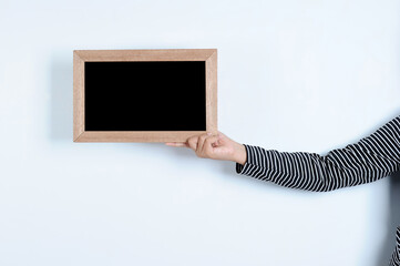 Wall Mural - Asian woman hands holding blackboard