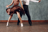 Young couple boy and girl dancing in ballroom dance Samba