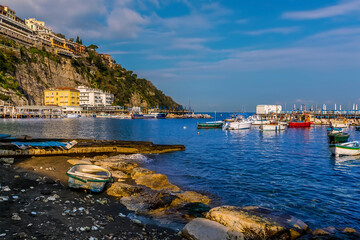 Wall Mural - A view looking out to sea from the marina Piccola, Sorrento, Italy in the early morning sunshine