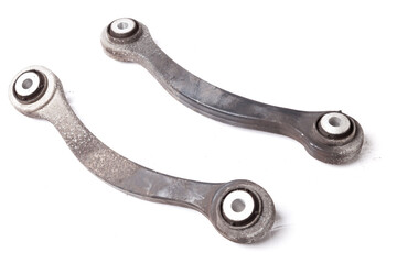 Wall Mural - A pair of aluminum levers of the car chassis on a white isolated background in a photo studio, a spare part for replacement during car repair or for sale at an auto-parsing.