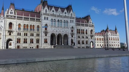 Wall Mural - Amazing video about the hungarian parliament building. Clear blue sky with clouds. Fantastic touristic destination in Budapest Hungary. 