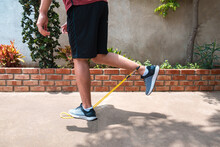 Man Doing Calf Exercise Using Resistance Bands