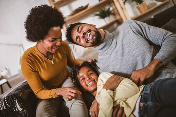 African american family spending time together at home. They are having fun