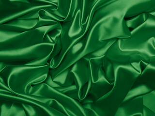 Wall Mural - Beautiful smooth elegant wavy emerald green satin silk luxury cloth fabric texture, abstract background design. Card or banner.