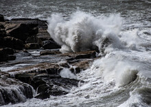Waves Splashing On Rocks At Shore