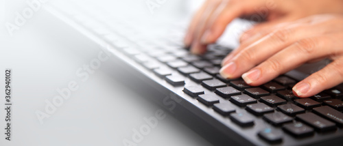 Cuadros en Lienzo Detail of female fingers typing on keyboard.