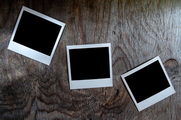 Poster - Top view of three integral films on a wooden table