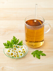 Sticker - Glass of tea with fresh Feverfew flowers